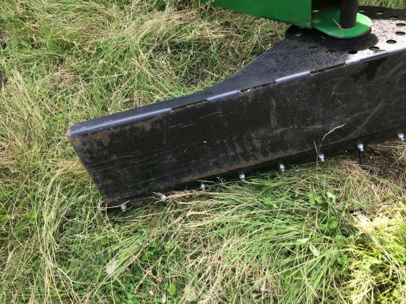 Tractor mounted scraper blade